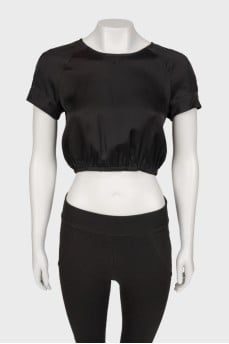 Black top on a zipper with a tag