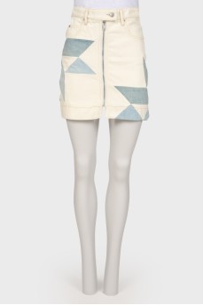 Skirt with geometric inserts with a tag