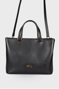 Leather bag with a metal logo brand