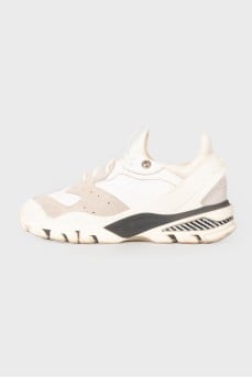 Sneakers with a rubber clasp on the heel