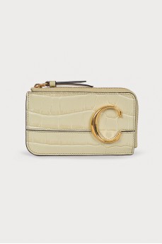 Leather light green wallet with a tag