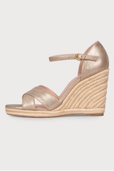 Golden sandals on a jute wedge