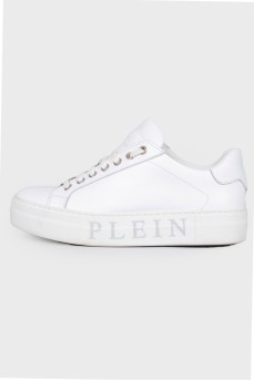 Sneakers with a print of a logo on the sole