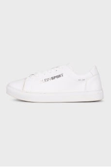 White sneakers with metallic brand logo