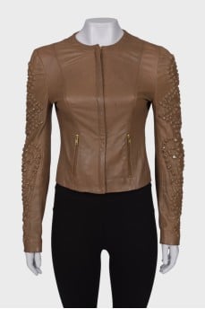 Leather jacket with rhinestones on the sleeves