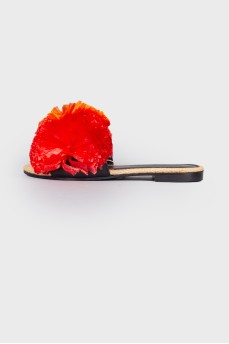 Slippers with red pom-poms