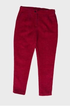 Children's red trousers with a textured pattern