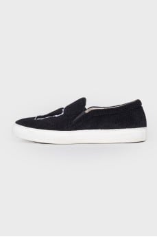 Black slip-ons in soft textile