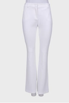 White flared trousers with tag