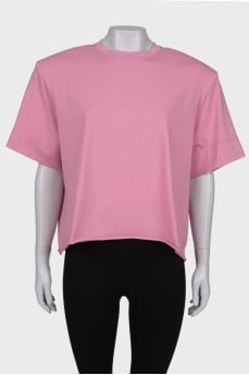 Pink T-shirt with shoulder pads and tag