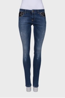 Jeans with lace inserts