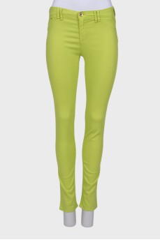 Light green jeans with a tag