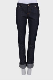 Navy blue jeans with orange stitching
