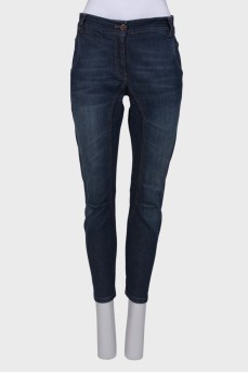 Blue jeans with a zip at the bottom