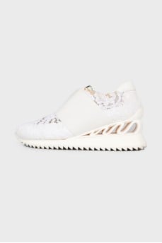 White sneakers with lace inserts