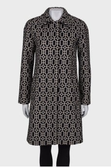 Coat in geometric black and white print