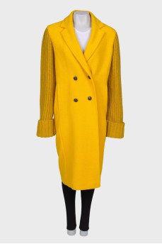 Yellow coat with knitted sleeves