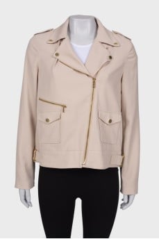 Windbreaker with gold hardware, with a tag