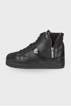Black boots decorated with rhinestones