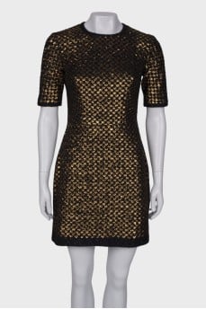 Dress is decorated with sequins