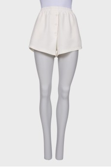 White shorts with buttons