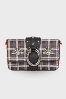 Bag in a cage with a wide strap