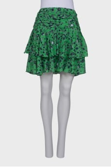 Green skirt with ruffles in print