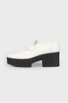 Black and white leather pumps