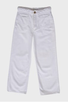 White jeans with a decorative belt