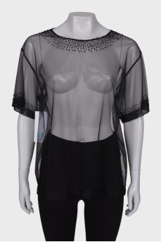 Translucent blouse with rhinestones with a tag