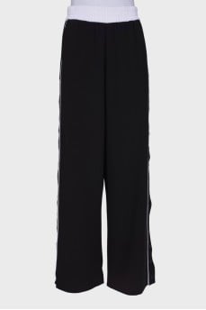 Black and white trousers with press-stud closure