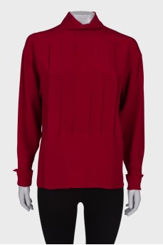Red pleated blouse