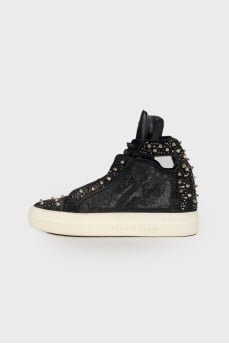 Sneakers decorated with rhinestones and spikes