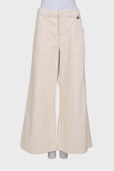 Beige palazzo trousers with tag