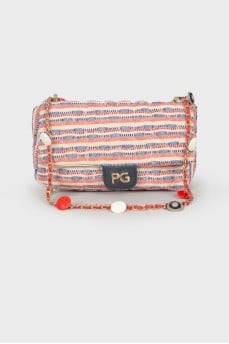 Textile bag with medallions on the strap