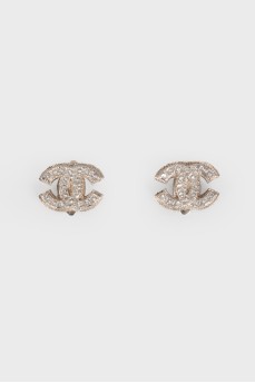 Silver earrings in the shape of the brand logo