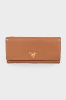 Brown leather wallet with brand logo