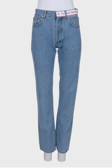 Blue jeans with brand logo