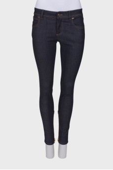 Navy blue jeans with a zip at the bottom