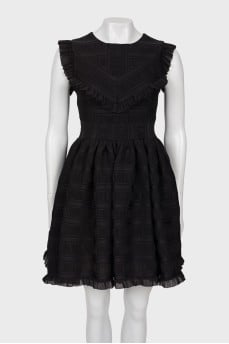 Black dress with a pattern and frills