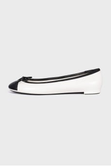 Black and white ballerinas with a bow