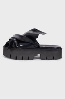 Black slip-on sandals with chunky soles