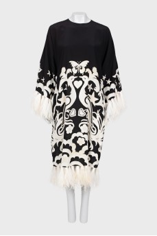 Dress with decorated hem and sleeves