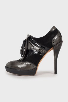 Embellished ankle boots with perforations
