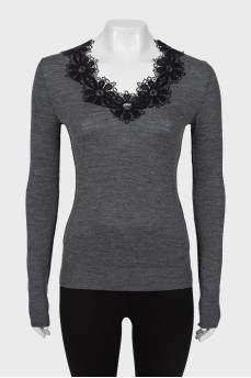 Wool jumper with embellished neckline