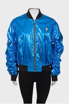 Blue bomber jacket with draped sleeves