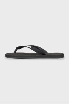 Black flip flops with brand logo