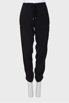 Black trousers decorated with sequins