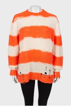 Knitted sweater with ripped effect