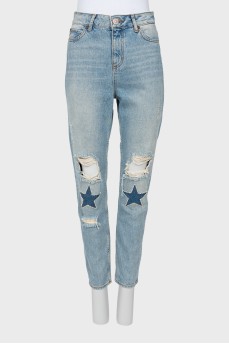 Ripped effect embellished jeans